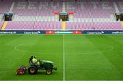 15 October 2019; A member of the Stade de Genève grounds staff prepares the pitch prior to the UEFA EURO2020 Qualifier match between Switzerland and Republic of Ireland in Geneva, Switzerland. Photo by Stephen McCarthy/Sportsfile
