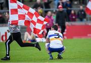 13 October 2019; A dejected Aidan McCrory of Errigal Ciaran as a Trillick supporter runs on to the field after the Tyrone County Senior Club Football Championship Final match between Errigal Ciaran and Trillick at Healy Park in Omagh, Tyrone. Photo by Oliver McVeigh/Sportsfile