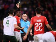 15 October 2019; Referee Szymon Marciniak issues Shane Duffy of Republic of Ireland with a yellow card during the UEFA EURO2020 Qualifier match between Switzerland and Republic of Ireland at Stade de Genève in Geneva, Switzerland. Photo by Stephen McCarthy/Sportsfile