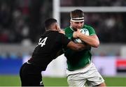 19 October 2019; Iain Henderson of Ireland  is tackled by Sevu Reece of New Zealand during the 2019 Rugby World Cup Quarter-Final match between New Zealand and Ireland at the Tokyo Stadium in Chofu, Japan. Photo by Brendan Moran/Sportsfile