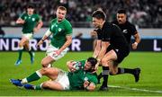 19 October 2019; Robbie Henshaw of Ireland in action against Beauden Barrett of New Zealand during the 2019 Rugby World Cup Quarter-Final match between New Zealand and Ireland at the Tokyo Stadium in Chofu, Japan. Photo by Brendan Moran/Sportsfile