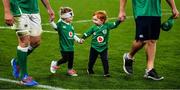 19 October 2019; Indie O'Mahony, left, daughter of Peter O'Mahony of Ireland, and Felix Ryan, son of John Ryan of Ireland, hold hands with each other and their fathers as they walk the pitch after the 2019 Rugby World Cup Quarter-Final match between New Zealand and Ireland at the Tokyo Stadium in Chofu, Japan. Photo by Brendan Moran/Sportsfile