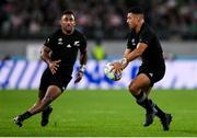 19 October 2019; Richie Mo'unga, right, passes to Sevu Reece of New Zealand during the 2019 Rugby World Cup Quarter-Final match between New Zealand and Ireland at the Tokyo Stadium in Chofu, Japan. Photo by Ramsey Cardy/Sportsfile