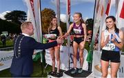 20 October 2019; Cllr Eoghan O'Brien, Mayor of Fingal, makes the winners presentation to Grace Carson of Northern Ireland, after she won the Junior Women 4500m XC event during the SPAR Autumn Open International Cross Country Festival at the National Sports Campus Abbotstown in Dublin. Photo by Sam Barnes/Sportsfile