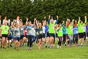 20 October 2019; Runners during the mass warm up ahead of the SPAR Cross Country Xperience at the National Sports Campus Abbotstown in Dublin. Photo by Sam Barnes/Sportsfile