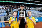 22 October 2019; Mícheál Ó Muircheartaigh with his twin grandsons Eoin, left, and Liam Wilkinson of Gaelscoil Bhrian Boroimhe Swords following the match between Gaelscoil Bhrian Boroimhe Swords and St Brigid's BNS Killester during day one of the Allianz Cumann na mBunscol finals at Croke Park in Dublin. Photo by Matt Browne/Sportsfile