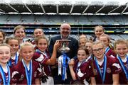 23 October 2019; Brian Kelly, Sales Manager at Allianz Ireland, presents the cup to Presentation PS, Terenure players after they beat Mount Anville PS, Kilmacud, in the Corn Comhar Linn Cup Final during day two of the Allianz Cumann na mBunscol Finals at Croke Park in Dublin. Photo by Piaras Ó Mídheach/Sportsfile