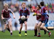 23 October 2019; Jake O'Rourke of St Cronan's SNS, Brackenstown, in action against Dean Dwyer, left, and Lee Poole of St Aidan's SNS, Brookfield, in the Corn Mhic Chaoilte Shield Final during day two of the Allianz Cumann na mBunscol Finals at Croke Park in Dublin. Photo by Piaras Ó Mídheach/Sportsfile