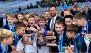 23 October 2019; David Gough of Cumann na mBunscol presents the St Pius X BNS, Terenure, team with the cup after they beat Ballyroan BNS in the Corn Kitterick Shield Final during day two of the Allianz Cumann na mBunscol Finals at Croke Park in Dublin. Photo by Piaras Ó Mídheach/Sportsfile