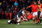 25 October 2019; Rory Scannell of Munster is tackled by Gareth Evans, left, and Tom Botha of Ospreys, hidden, during the Guinness PRO14 Round 4 match between Munster and Ospreys at Irish Independent Park in Cork. Photo by Sam Barnes/Sportsfile