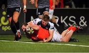 25 October 2019; James Cronin of Munster goes over to score his side's first try despite the tackle by Olly Cracknell of Ospreys during the Guinness PRO14 Round 4 match between Munster and Ospreys at Irish Independent Park in Cork. Photo by Sam Barnes/Sportsfile