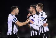 25 October 2019; Dane Massey celebrates with his Dundalk team-mates Brian Gartland, left, and Daniel Kelly, right, after scoring his side's  opening goal during the SSE Airtricity League Premier Division match between Dundalk and St Patrick's Athletic at Oriel Park in Dundalk, Co Louth. Photo by Stephen McCarthy/Sportsfile