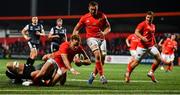 25 October 2019; Mike Haley of Munster goes over to score his side's third try despite the attempted tackle from Olly Cracknell of Ospreys during the Guinness PRO14 Round 4 match between Munster and Ospreys at Irish Independent Park in Cork. Photo by David Fitzgerald/Sportsfile