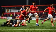 25 October 2019; Mike Haley of Munster goes over to score his side's third try despite the attempted tackle from Olly Cracknell of Ospreys during the Guinness PRO14 Round 4 match between Munster and Ospreys at Irish Independent Park in Cork. Photo by David Fitzgerald/Sportsfile