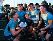 26 October 2019; UCD players celebrate with the cup during the Maxol Conroy Cup final match between University College Dublin and Trinity College Dublin at Terenure College RFC in Lakelands Park, Dublin. Photo by Eóin Noonan/Sportsfile