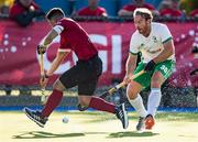 26 October 2019; Stuart Loughrey of Ireland and Gabriel Ho-Garcia of Canada vie for the ball during the FIH Men's Olympic Qualifier match between Canada and Ireland at Rutledge Field, in West Vancouver, British Columbia, Canada. Photo by Darryl Dyck/Sportsfile