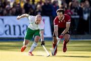 26 October 2019; Eugene Magee of Ireland and Adam Froese of Canada fight for the ball during the FIH Men's Olympic Qualifier match at Rutledge Field, in West Vancouver, British Columbia, Canada. Photo by Darryl Dyck/Sportsfile