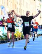27 October 2019; Claire and Jonathan Behan from Wicklow cross the finish line in today’s 2019 KBC Dublin Marathon. 22,500 runners took to the Fitzwilliam Square start line today to participate in the 40th running of the KBC Dublin Marathon, making it the fifth largest marathon in Europe. Photo by Sam Barnes/Sportsfile