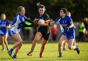 27 October 2019; Doireann O'Sullivan of Mourneabbey in action against Maeve Ryan, left, and Treasa McGrath of Ballymacarbry during the Munster Ladies Football Senior Club Championship Final match between Ballymacarbry and Mourneabbey at Galtee Rovers GAA Club, in Bansha, Tipperary. Photo by Harry Murphy/Sportsfile