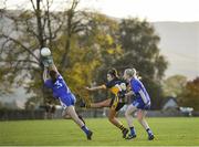27 October 2019; Laura Fitzgerald of Mourneabbey kicks a point despite the attention of Michelle McGrath and Mairéad Wall of Ballymacarbry during the Munster Ladies Football Senior Club Championship Final match between Ballymacarbry and Mourneabbey at Galtee Rovers GAA Club, in Bansha, Tipperary. Photo by Harry Murphy/Sportsfile