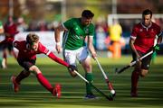 27 October 2019;  Shane O'Donoghue of Ireland is pursued by James Kirkpatrick of Canada, left, as Matthew Sarmento, right, watches during the second half of the FIH Men's Olympic Qualifier match at Rutledge Field, in West Vancouver, British Columbia, Canada. Photo by Darryl Dyck/Sportsfile