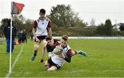 30 October 2019; Ross Ashmore of Midlands Area scores a try despite the tackle of Taylor O'Sullivan of  Metro Area during the 2019 Shane Horgan Cup Second Round match between Midlands Area and Metro Area at Tullamore RFC in Tullamore, Offaly. Photo by Matt Browne/Sportsfile