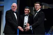 1 November 2019; Down hurler Caolan Taggart is presented with his Champion 15 award by Uachtarán Cumann Lúthchleas Gael John Horan, left, and GPA Chairman Seamus Hickey during the PwC All-Stars 2019 at the Convention Centre in Dublin. Photo by Brendan Moran/Sportsfile