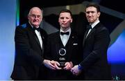 1 November 2019; Derry hurler Sé McGuigan is presented with his Champion 15 award by Uachtarán Cumann Lúthchleas Gael John Horan, left, and GPA Chairman Seamus Hickey during the PwC All-Stars 2019 at the Convention Centre in Dublin. Photo by Brendan Moran/Sportsfile