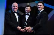 1 November 2019; Down hurler Dáithí Sands is presented with his Champion 15 award by Uachtarán Cumann Lúthchleas Gael John Horan, left, and GPA Chairman Seamus Hickey during the PwC All-Stars 2019 at the Convention Centre in Dublin. Photo by Brendan Moran/Sportsfile