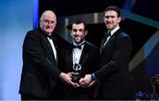 1 November 2019; Leitrim hurler James Glancy is presented with his Champion 15 award by Uachtarán Cumann Lúthchleas Gael John Horan, left, and GPA Chairman Seamus Hickey during the PwC All-Stars 2019 at the Convention Centre in Dublin. Photo by Brendan Moran/Sportsfile