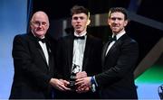 1 November 2019; Leitrim hurler Enda Moreton is presented with his Champion 15 award by Uachtarán Cumann Lúthchleas Gael John Horan, left, and GPA Chairman Seamus Hickey during the PwC All-Stars 2019 at the Convention Centre in Dublin. Photo by Brendan Moran/Sportsfile