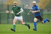 2 November 2019; Shane Nolan of Ireland in action against Rory Kennedy of Scotland during the Senior Hurling Shinty International 2019 match between Ireland and Scotland at the GAA National Games Development Centre in Abbotstown, Dublin. Photo by Piaras Ó Mídheach/Sportsfile