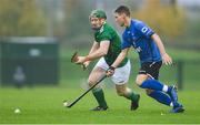 2 November 2019; Willie Dunphy of Ireland in action against Daniel Grieve of Scotland during the Senior Hurling Shinty International 2019 match between Ireland and Scotland at the GAA National Games Development Centre in Abbotstown, Dublin. Photo by Piaras Ó Mídheach/Sportsfile