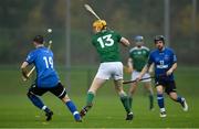 2 November 2019; Cillian Kiely of Ireland in action against Craig Mainland, left, and Daniel Cameron of Scotland during the Senior Hurling Shinty International 2019 match between Ireland and Scotland at the GAA National Games Development Centre in Abbotstown, Dublin. Photo by Piaras Ó Mídheach/Sportsfile