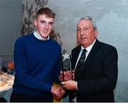 2 November 2019; Ciaran Burke of Ballinamere GAA, Offaly, and Ireland U21, is presented with his Best and Fairest Award by Keith Loardes, President of the Camanachd Association, at the Hurling Shinty International 2019 Banquet at Castleknock Hotel in Dublin. Photo by Seb Daly/Sportsfile
