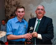 2 November 2019; Ruaridh Anderson of Kingussie Camanachd Club, and Scotland U21, is presented with his Best and Fairest award by Jimmy O'Dwyer, Chairman of the Hurling Development Committee, speaking at the Hurling Shinty International 2019 Banquet at Castleknock Hotel in Dublin. Photo by Seb Daly/Sportsfile