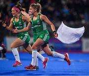 3 November 2019; Ireland players Bethany Barr, left, and Chloe Watkins celebrate winning the penalty strokes and qualifying for the Tokyo2020 Olympic Games during the FIH Women's Olympic Qualifier match between Ireland and Canada at Energia Park in Dublin. Photo by Brendan Moran/Sportsfile