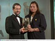 28 November 2003; Emilie O'hAilpin, representing her son Setanta, Cork, is presented with his All-Star award by GAA President Sean Kelly at the VODAFONE GAA All-Star Awards in the Citywest Hotel, Dublin. Football. Hurling. Picture credit; Brendan Moran / SPORTSFILE *EDI*