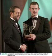 28 November 2003; Tommy Walsh, Kilkenny, is presented with his All-Star award by GAA President Sean Kelly at the VODAFONE GAA All-Star Awards in the Citywest Hotel, Dublin. Football. Hurling. Picture credit; Ray McManus / SPORTSFILE *EDI*