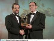 28 November 2003; Brian Dooher, Tyrone, is presented with his All-Star award by GAA President Sean Kelly at the VODAFONE GAA All-Star Awards in the Citywest Hotel, Dublin. Football. Hurling. Picture credit; Brendan Moran / SPORTSFILE *EDI*