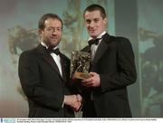 28 November 2003; Brian McGuigan, Tyrone, is presented with his All-Star award by GAA President Sean Kelly at the VODAFONE GAA All-Star Awards in the Citywest Hotel, Dublin. Football. Hurling. Picture credit; Brendan Moran / SPORTSFILE *EDI*