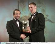 28 November 2003; Cormac McAnallen, Tyrone, is presented with his All-Star award by GAA President Sean Kelly at the VODAFONE GAA All-Star Awards in the Citywest Hotel, Dublin. Football. Hurling. Picture credit; Brendan Moran / SPORTSFILE *EDI*