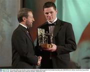 28 November 2003; Conor Gormley, Tyrone, is presented with his All-Star award by GAA President Sean Kelly at the VODAFONE GAA All-Star Awards in the Citywest Hotel, Dublin. Football. Hurling. Picture credit; Ray McManus / SPORTSFILE *EDI*