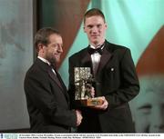 28 November 2003; Cormac McAnallen, Tyrone, is presented with his All-Star award by GAA President Sean Kelly at the VODAFONE GAA All-Star Awards in the Citywest Hotel, Dublin. Football. Hurling. Picture credit; Ray McManus / SPORTSFILE *EDI*