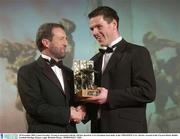 28 November 2003; Conor Gormley, Tyrone, is presented with his All-Star award by GAA President Sean Kelly at the VODAFONE GAA All-Star Awards in the Citywest Hotel, Dublin. Football. Hurling. Picture credit; Brendan Moran / SPORTSFILE *EDI*