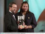 28 November 2003; Emilie O'hAilpin, representing her son Setanta, is presented with his All-Star award by GAA President Sean Kelly at the VODAFONE GAA All-Star Awards in the Citywest Hotel, Dublin. Football. Hurling. Picture credit; Ray McManus / SPORTSFILE *EDI*