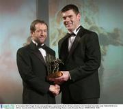 28 November 2003; Fergal Byron, Laois goalkeeper, is presented with his All-Star award by GAA President Sean Kelly at the VODAFONE GAA All-Star Awards in the Citywest Hotel, Dublin. Football. Hurling. Picture credit; Brendan Moran / SPORTSFILE *EDI*