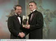 28 November 2003; Joe Higgins, Laois, is presented with his All-Star award by GAA President Sean Kelly at the VODAFONE GAA All-Star Awards in the Citywest Hotel, Dublin. Football. Hurling. Picture credit; Brendan Moran / SPORTSFILE *EDI*