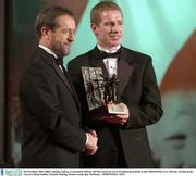 28 November 2003; Ollie Canning, Galway, is presented with his All-Star award by GAA President Sean Kelly at the VODAFONE GAA All-Star Awards in the Citywest Hotel, Dublin. Football. Hurling. Picture credit; Ray McManus / SPORTSFILE *EDI*