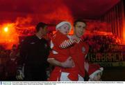 28 November 2003; Shelbourne captain Owen Heary leads his team out, with his daughter Elle and son Eoin, before the start of the game. eircom league Premier Division, Shamrock Rovers v Shelbourne, Tolka Park, Dublin. Soccer. Picture credit; David Maher / SPORTSFILE *EDI*